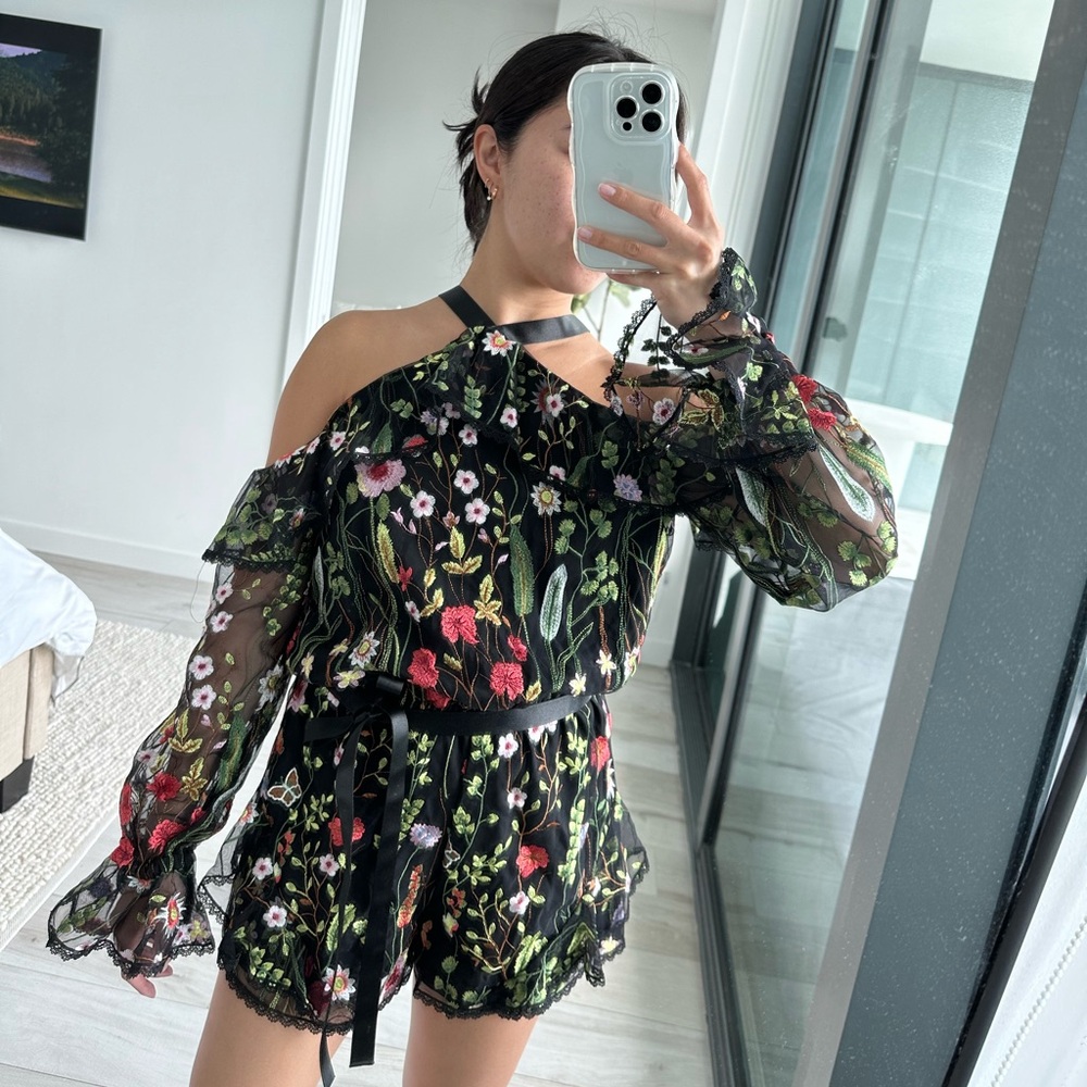Alexis Black Floral Romper in Size XS.